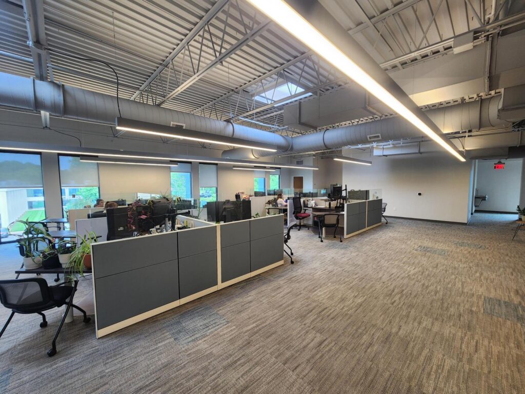 an office with cubicles and desks