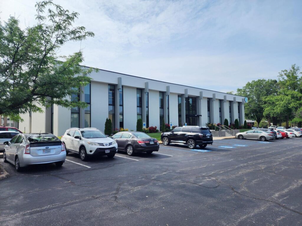 Only CNC Jobs Office with cars parked in front of it